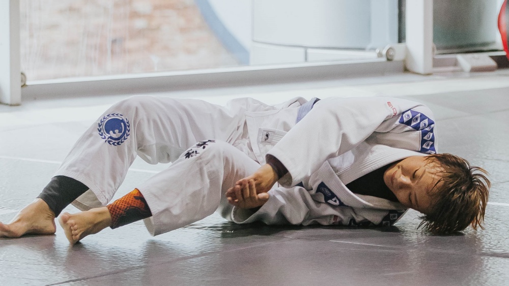 Three-Stripe White Belt Appointed 'Head Student' After Six Weeks Of Training; Now Demonstrates Armbar Mechanics To Blue Belts Who Have Been Training Longer Than He's Been Employed